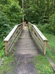 Barclay Farmstead bridge over the river and through the woods.